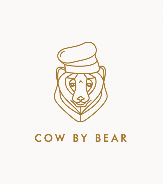 Logo of a stylized cow wearing a chef's hat, with the brand name 'COW BY BEAR' in brown text beneath.