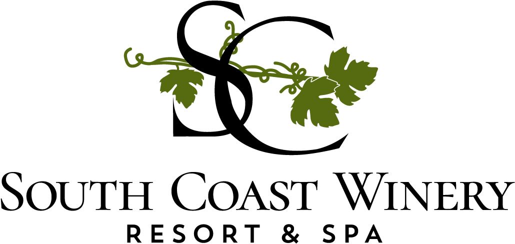 Green grapevine with curling tendrils across a black background, forming a decorative border.