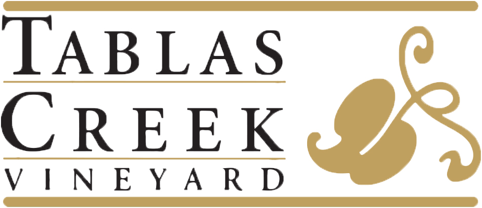 Tablas Creek Vineyard logo with black serif text and gold decorative lines; a gold grape leaf motif is on the right side of the image.