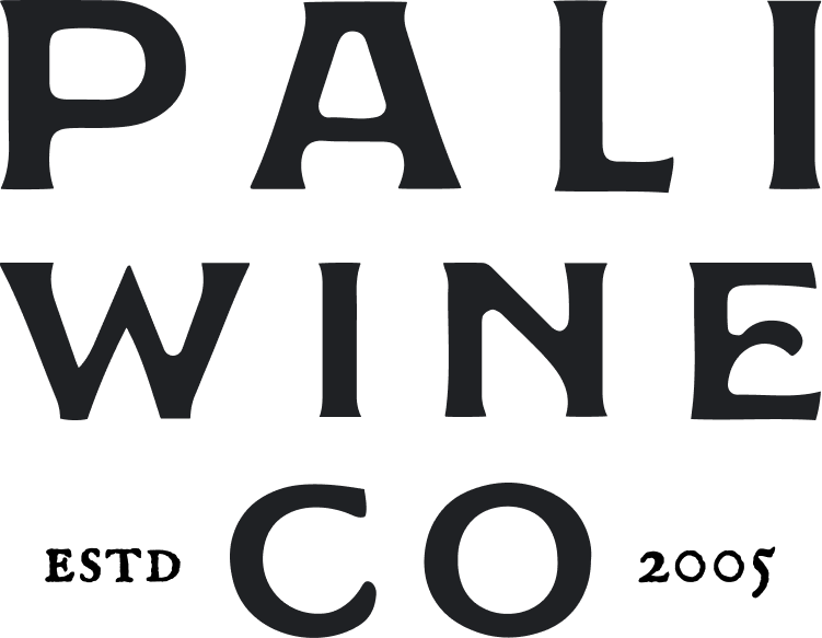 Logo for Pali Wine Co with the words PALI (top), WINE (middle), CO (bottom) in dark bold lettering.